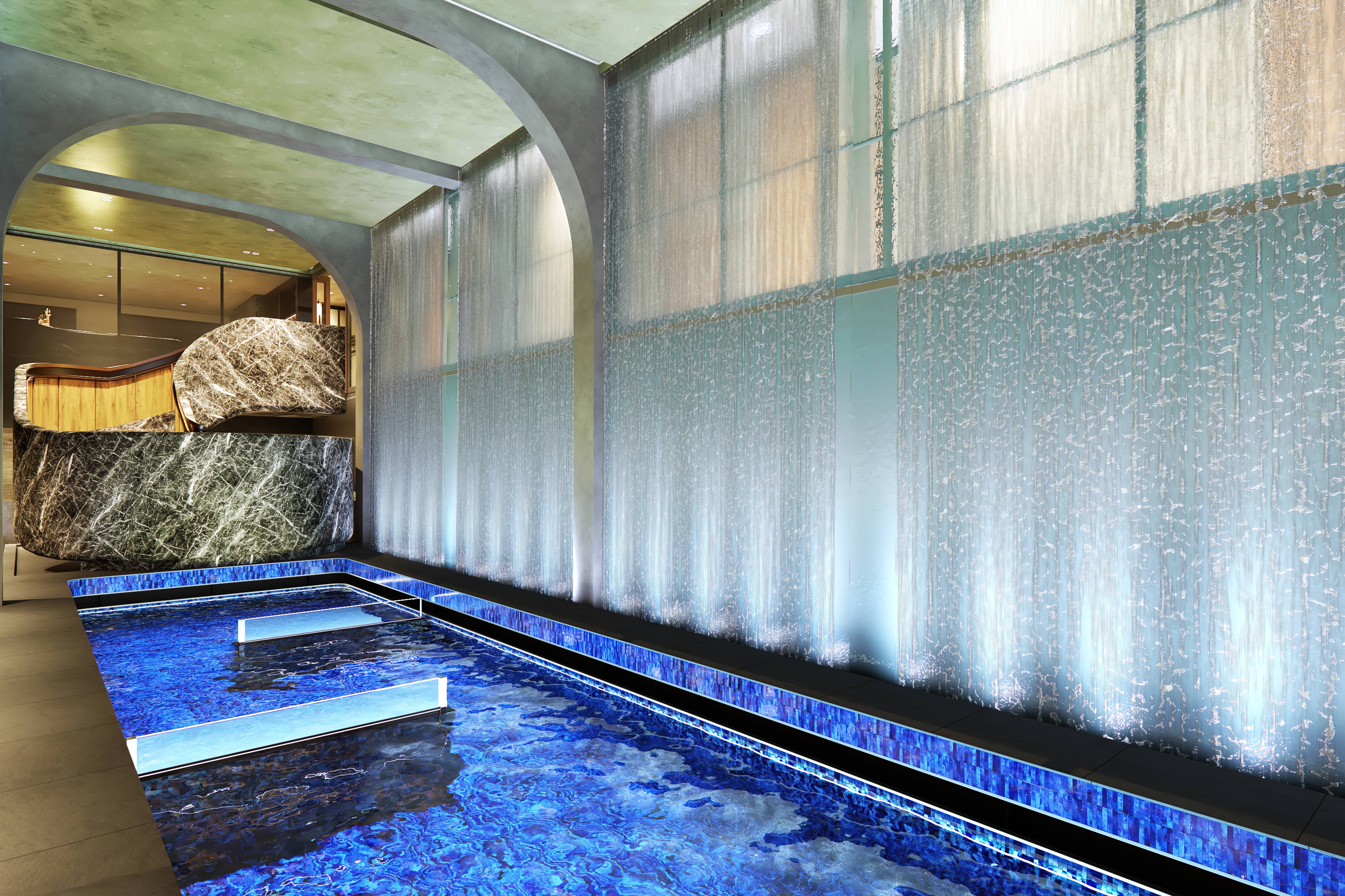 Illustration of an indoor pool with a water feature.
