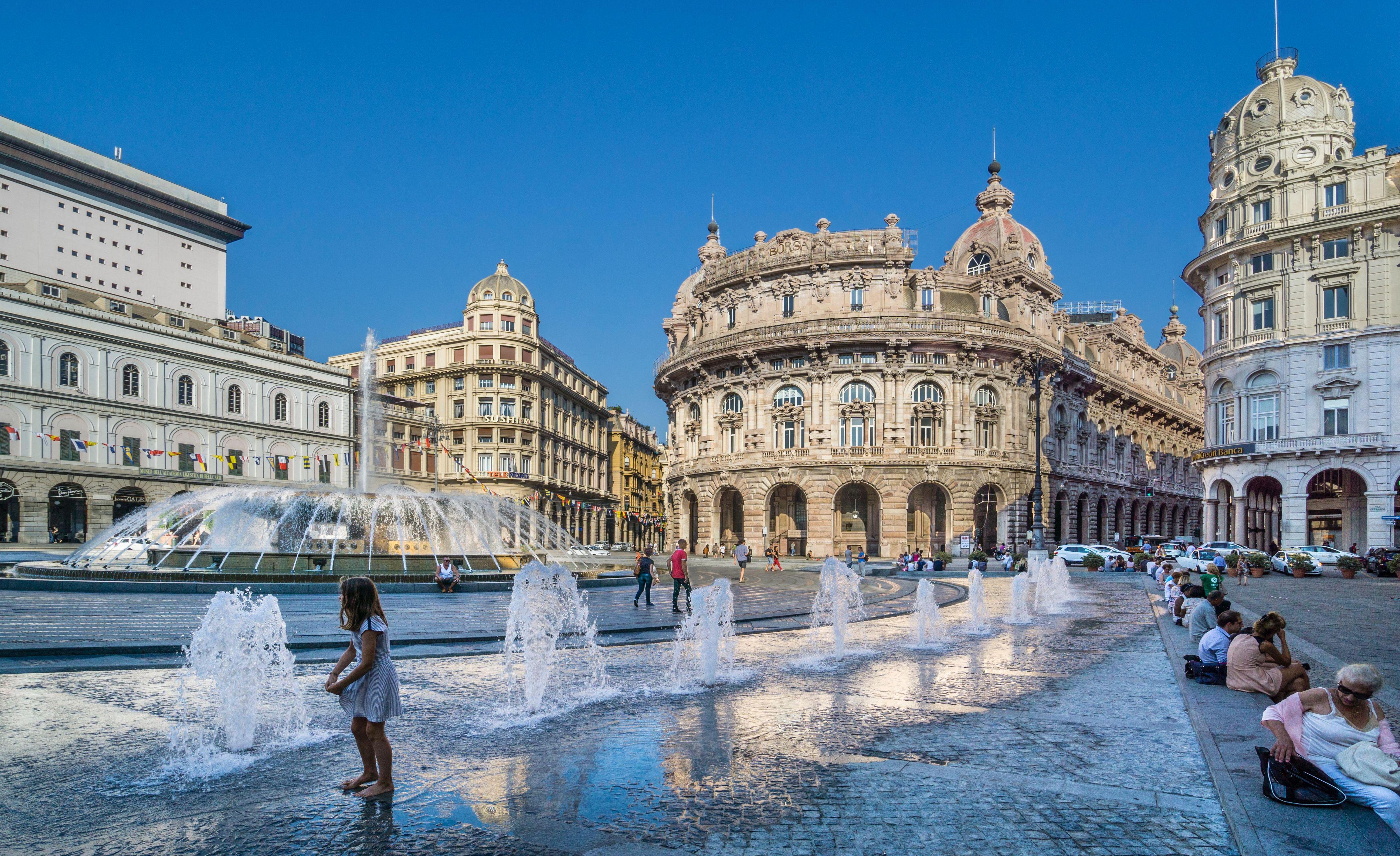 Piazza De Ferrari in Genoa, Italy, showcasing a grand fountain amidst surrounding architecture.