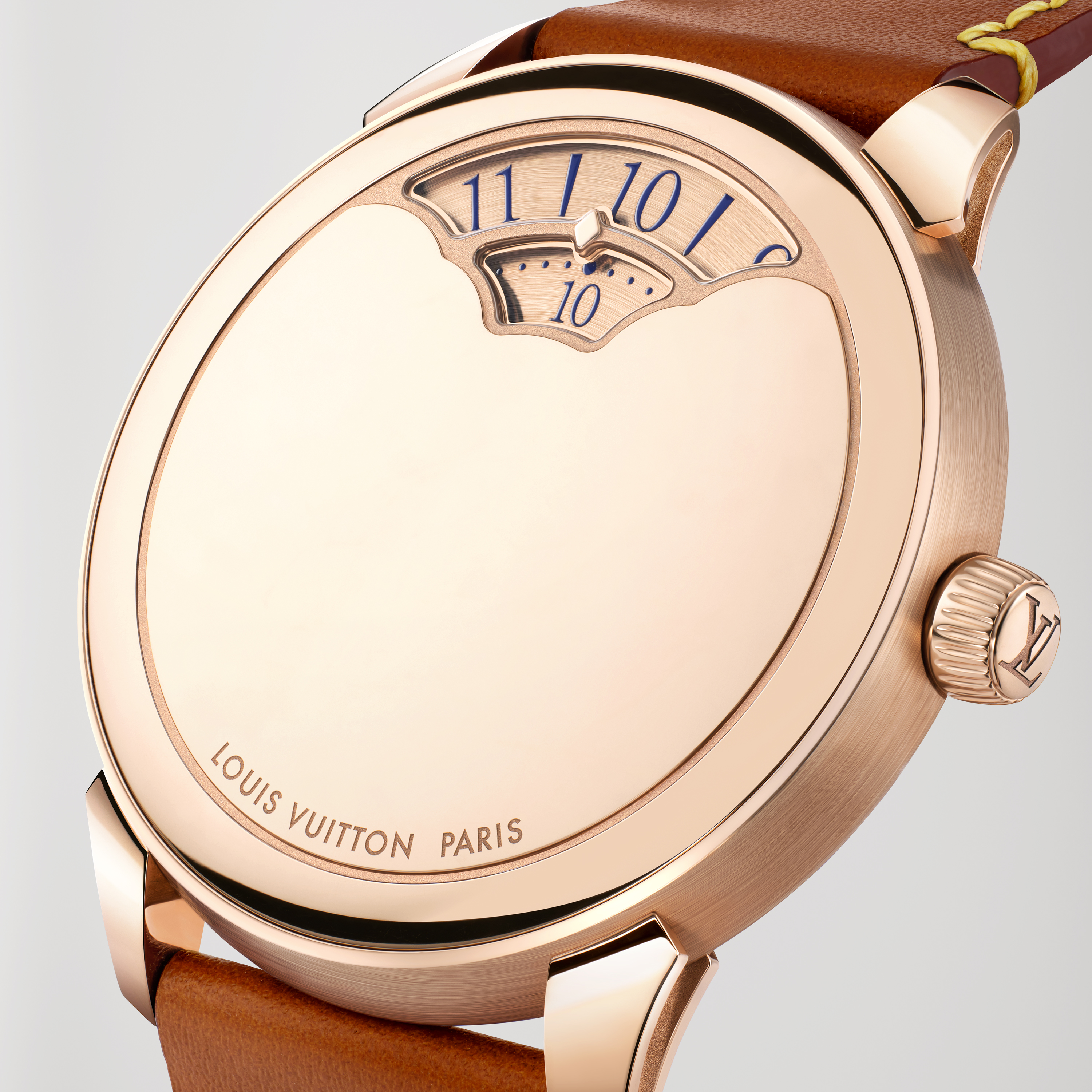 Rose gold Louis Vuitton watch with brown leather strap.