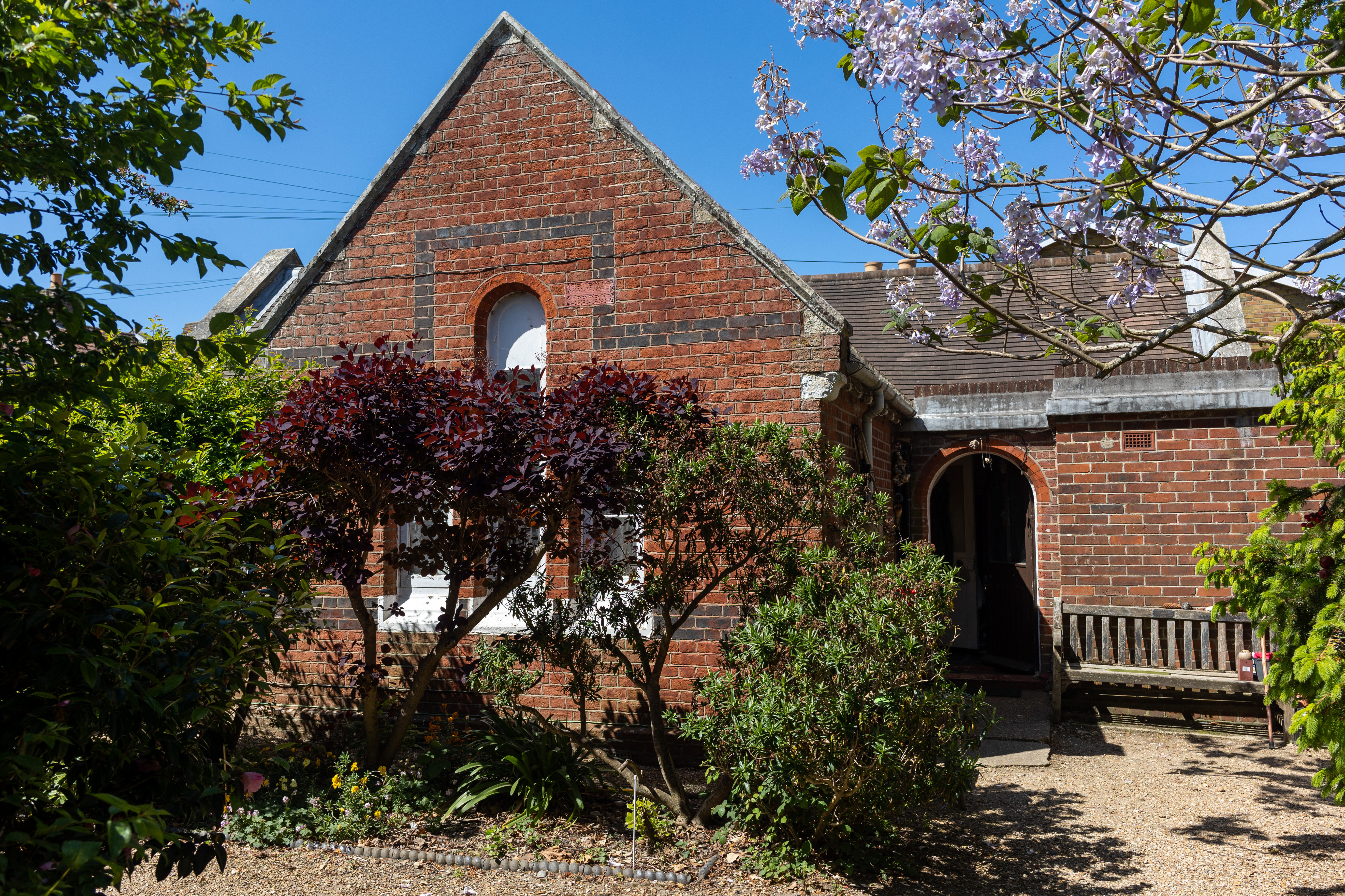 Brick building with garden.