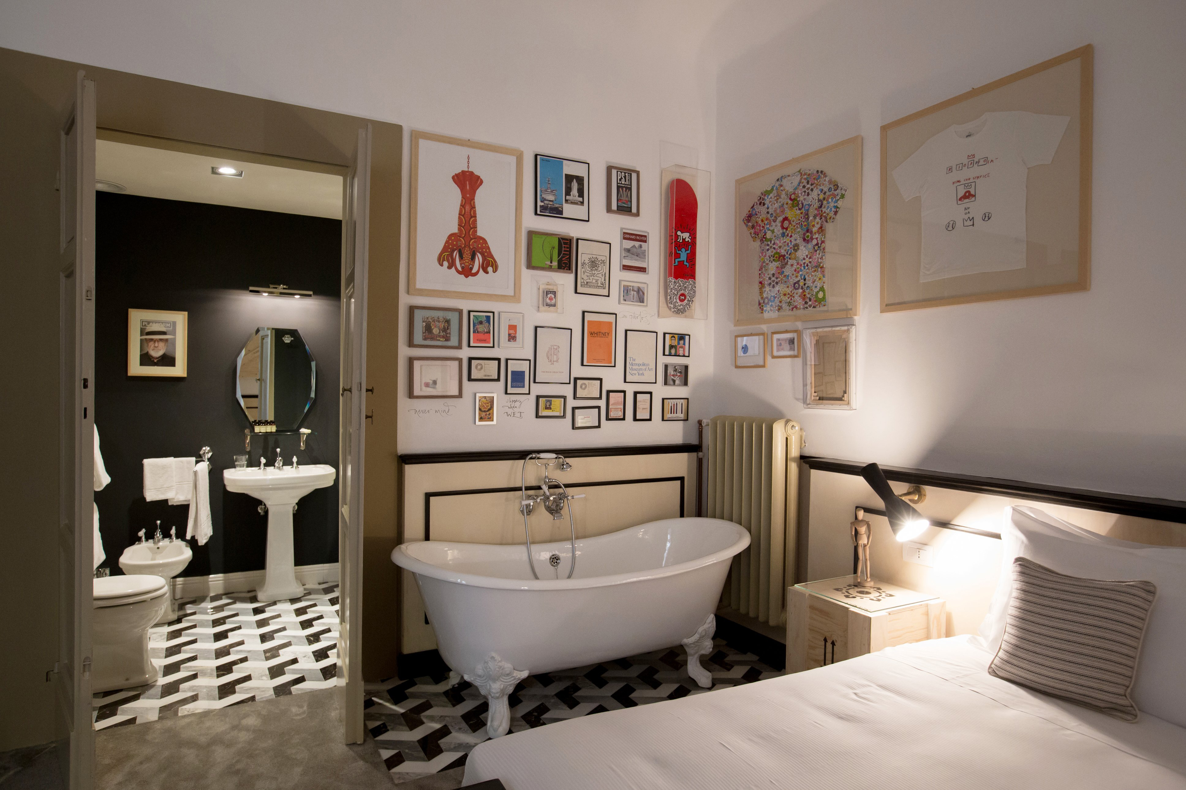 A guest room with a bath at AdAstra hotel in Florence, Italy