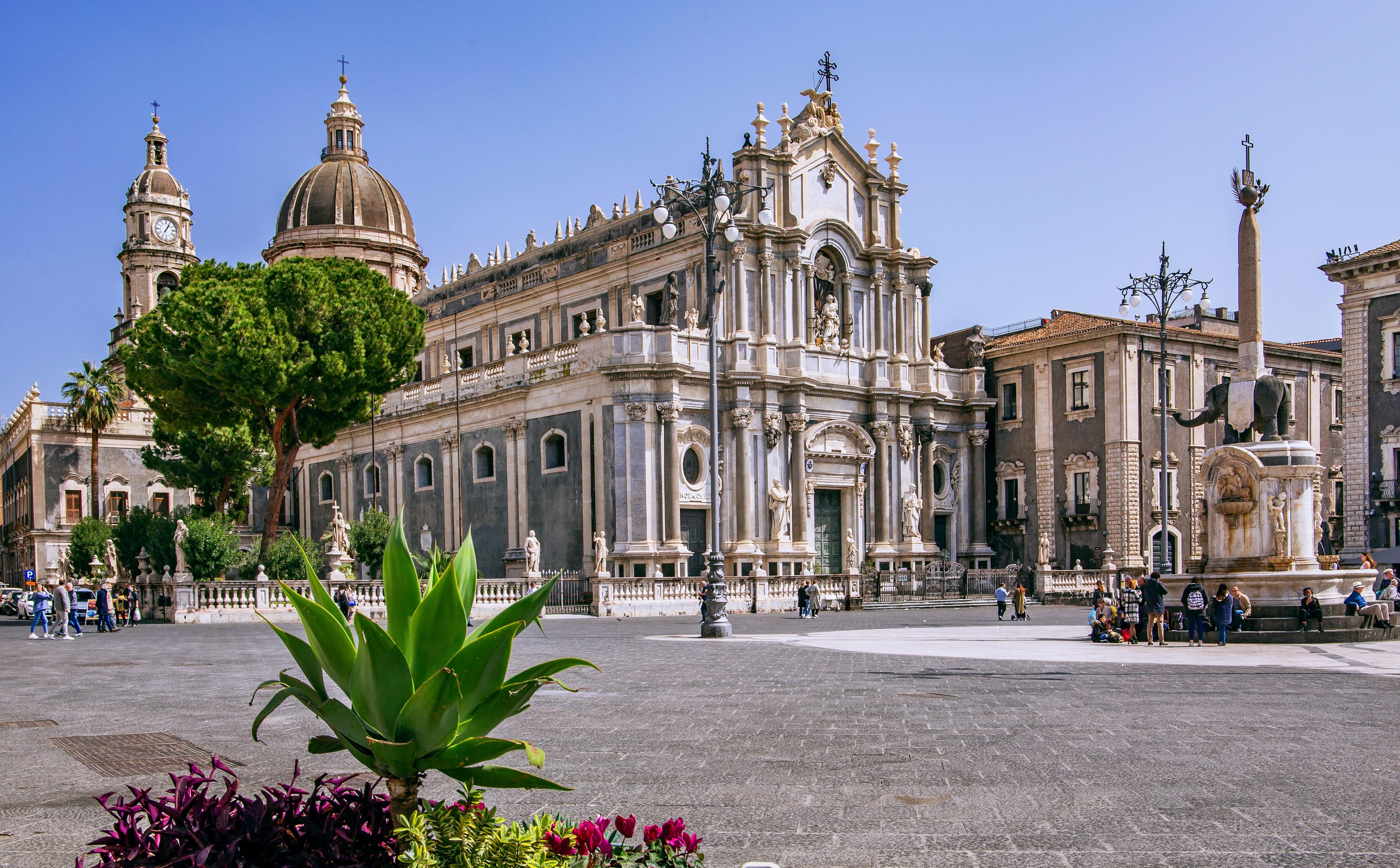 Historic square in Catania, Sicily with its stunning cathedral and fountain.