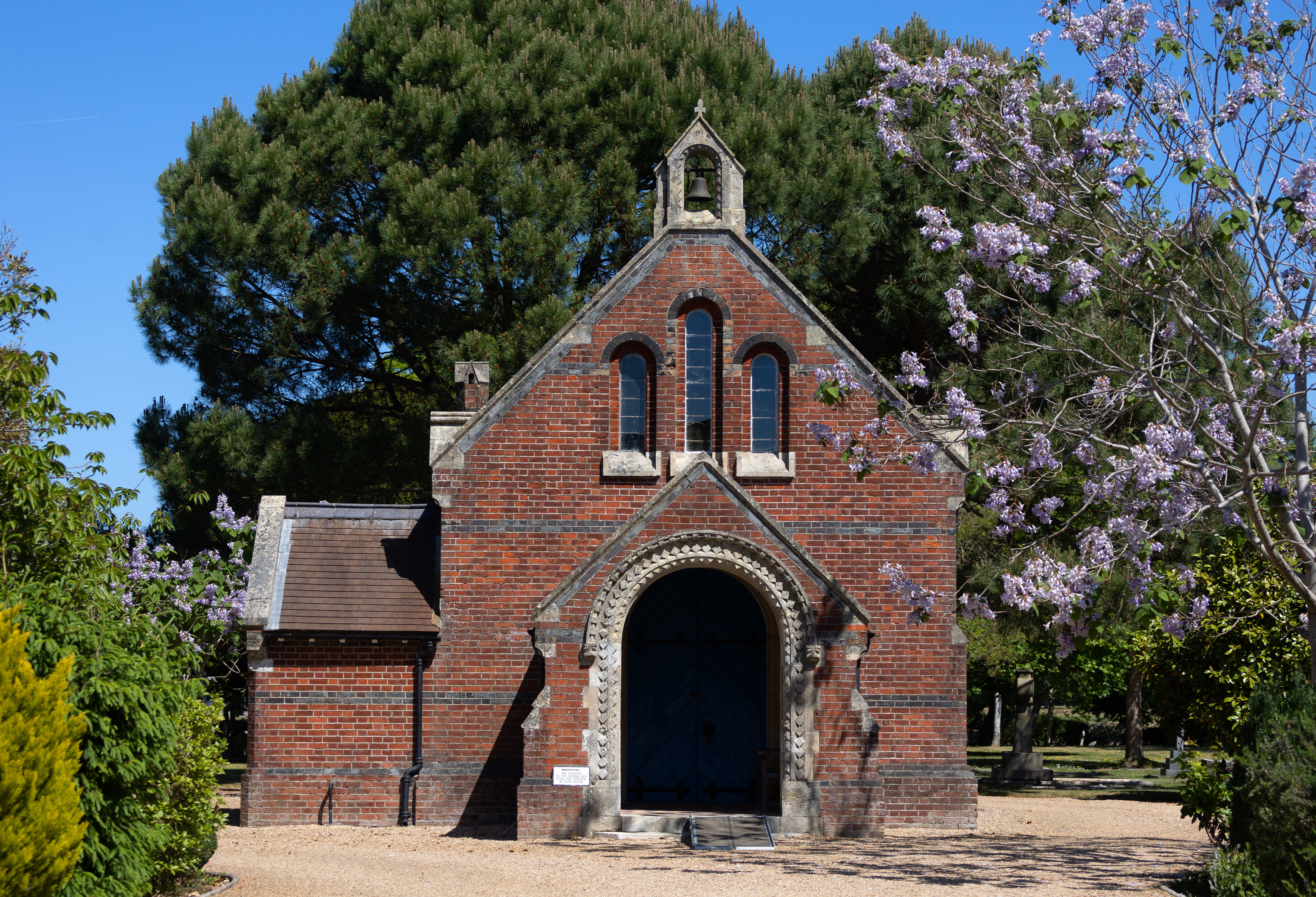 Brick chapel in a cemetery.