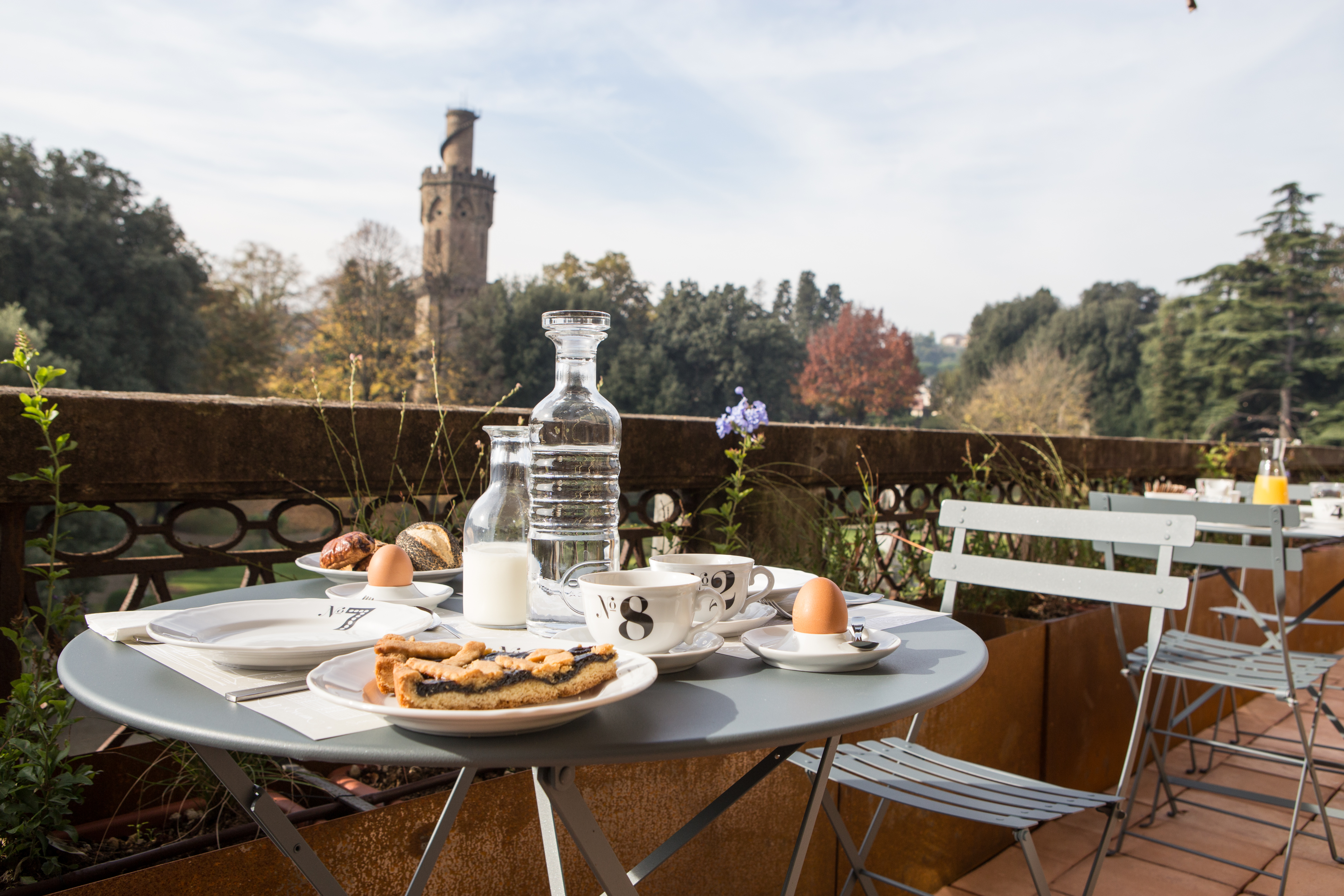 A table set for breakfast on a terrace at AdAstra hotel in Florence, Italy